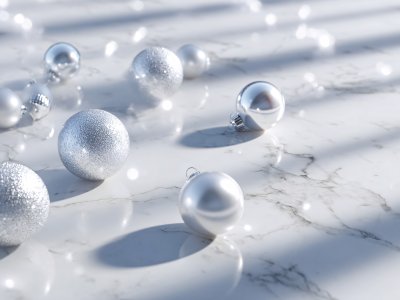 white christmas baubles on marble surface