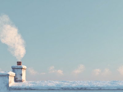 chimney with smoke in snowy winter scene