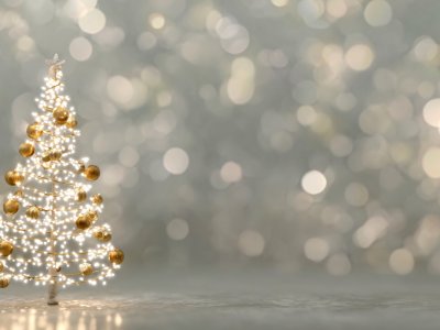 christmas tree with golden ornaments and glowing lights