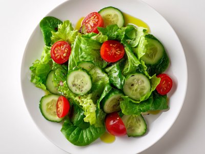fresh cucumber and tomato salad with olive oil dressing