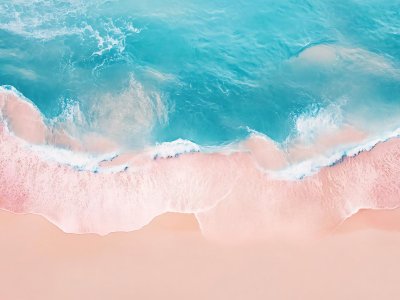 serene beach with gentle waves and soft pink sand