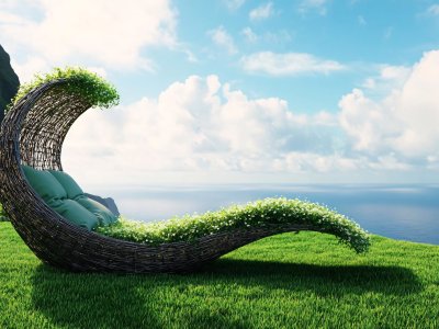 nature-inspired lounge chair shaped like a wave with flowers and ocean view